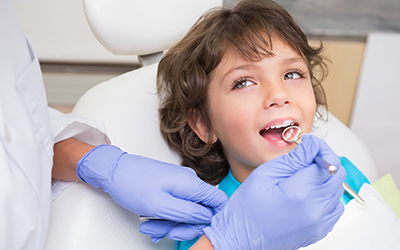 A young boy having dental work done