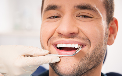 Man smiling at dentist