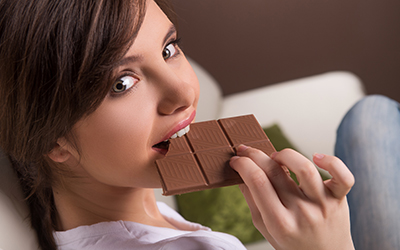 A woman eating chocolate