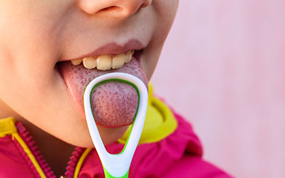 Child's tongue with tongue brush