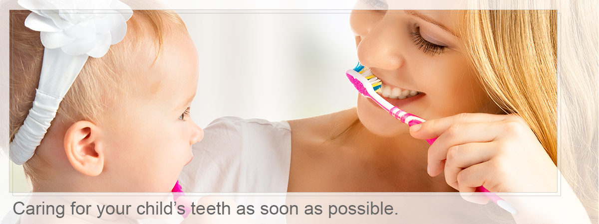 Mother and babay brushing, Caring for your child’s teeth as soon as possible.