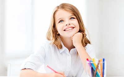 A young girl smiling