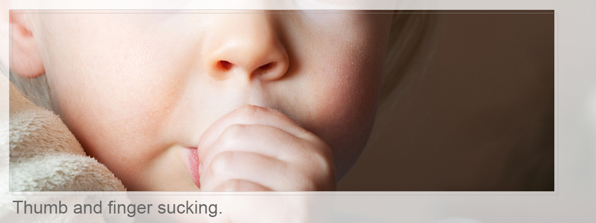 Close-up of boy with thumb sucking, Thumb and finger sucking.