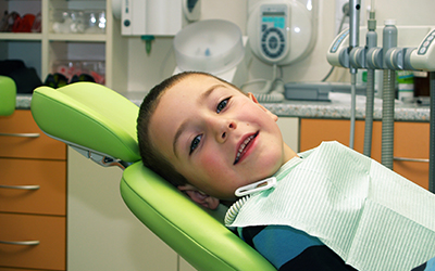 A young boy sitting in a dental chair