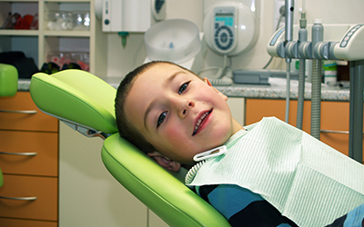 A young boy sitting in a dental chair