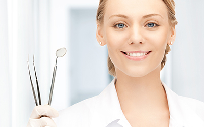 Dentist with dental tools